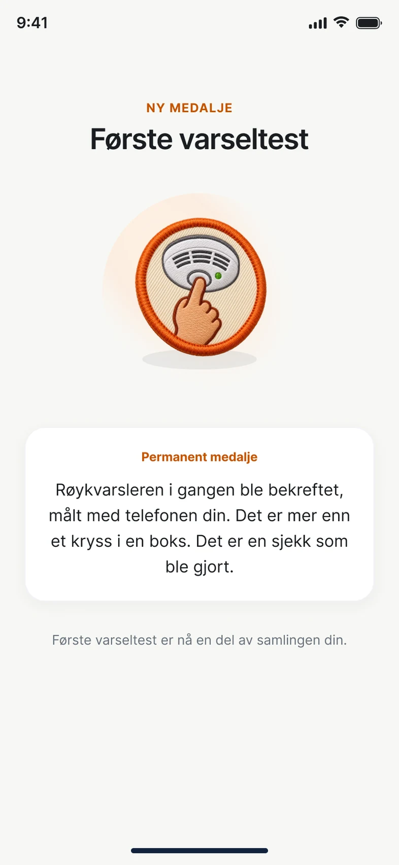 Medaljen Første varseltest i FireHub Personal på mobilen.